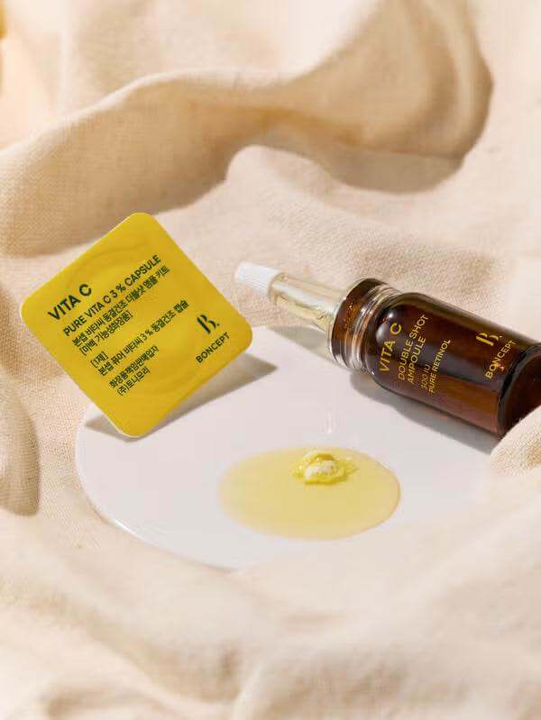 Boncept Vita C Double Shot Ampoule Kit - Fresh-Mix Brightening Serum (7-Day Treatment) with Vita C capsule and serum on plate.